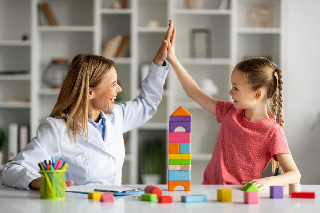 little-girl-giving-high-five-to-child-development-2023-05-30-11-34-29-utc.jpg